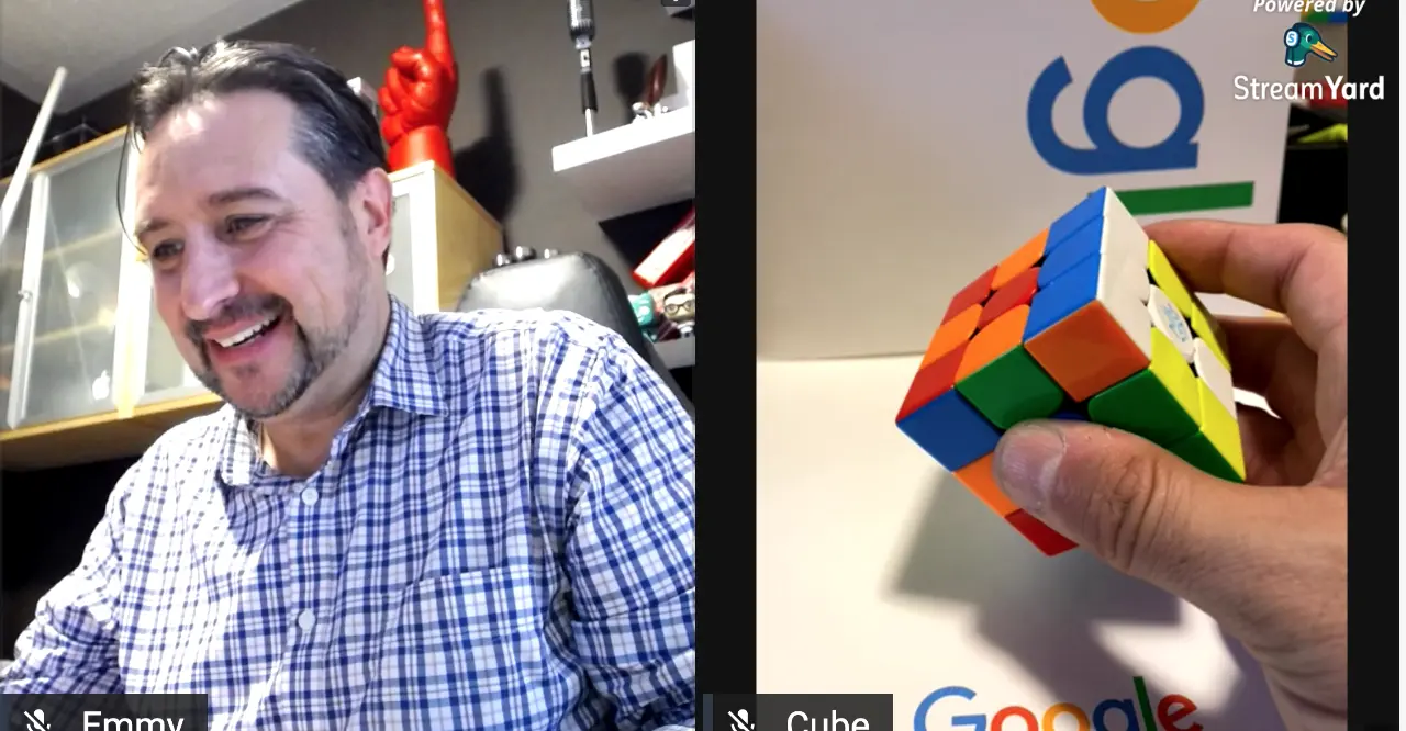 Emmy holding up a Rubik’s Cube during a live virtual workshop